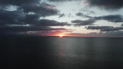 4K drone flight over the sea during sunrise along the Welsh coast 動画素材 296803778