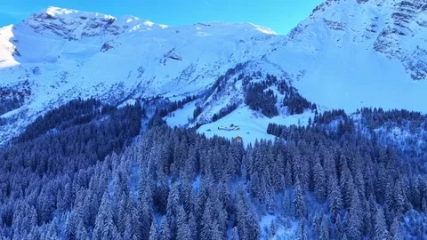 4K Drone Flight Over Snowy Alpine Chalets in Winter Stock Footage 329965872
