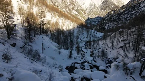 4k drone flight over the valley in mountain panorama, alpine forest and peak Stock Footage 148031245