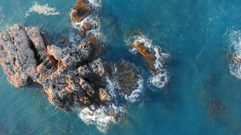 4k drone flight straight-down footage of volcanic rocks in Mediterranean sea. Stock Footage 123346019