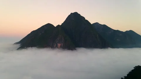 4k drone flight through passing through the mountains with sunset 스톡 동영상 344313714