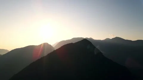 4k drone flight through passing through the mountains with sunset 스톡 동영상 344313805
