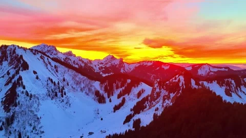 4K Drone Flight Toward Snowy Mountain Peaks At Sunset Stock Footage 330723223