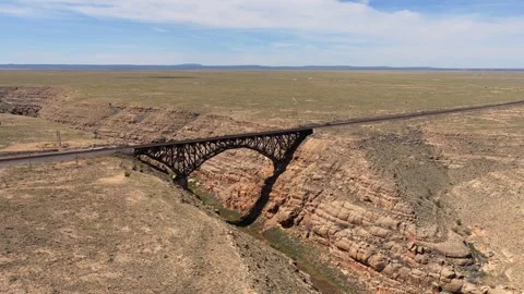 4K Drone Flight: Train Tracks Crossing A Desert Canyon Bridge Stock Footage 338986061