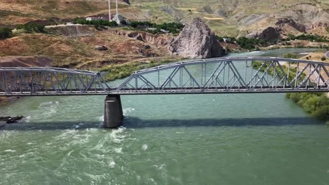4K Drone Flight Upstream Toward Historic Stone and Railway Bridges Stock Footage 336240116