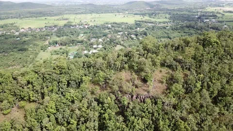 4k Drone fly over hill and village appear Stock Footage 161525349