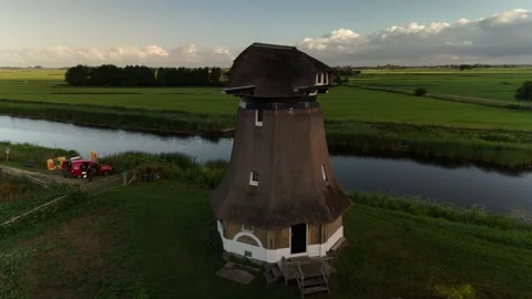 4K Drone Flyby Dutch Windmill at Sunrise – Scenic Netherlands Aerial Видео 317401738