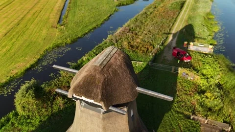 4K Drone Flyby Dutch Windmill by Canal at Sunrise Clear Sky 库存影片 317401811