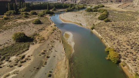4k Drone flying above a river that flows through the desert in Patagonia. Stock Footage 154623478