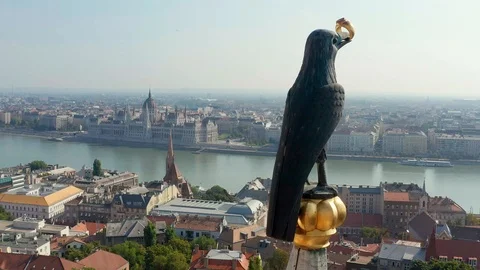4K drone flying around raven statue on top of Matthias Church Stock Footage 115103546