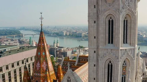 4K drone flying backwards between the towers of Matthias Church Stock Footage 115103562