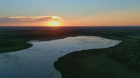 4K Drone Flying Backwards Looking at Sunset Over Lake Champlin MN Stock Footage 220468957