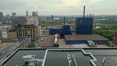 4K Drone Flying Backwards over Rooftops facing Guthrie Theater In Minneapolis Stock Footage 220468643