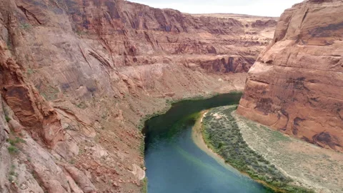 4K drone flying in the beautiful deep red Grand Canyon with green Colorado river Stock Footage 135078850