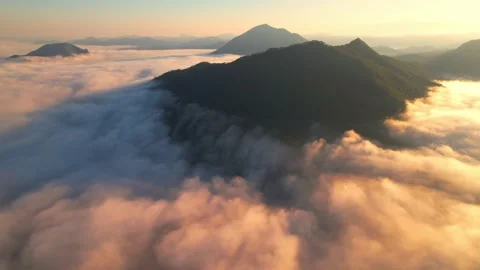 4K Drone Flying in the clouds. Flying through the clouds during sunrise Video stock 165864778