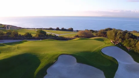 4K drone flying Hole 11 at Trump LA golf course w/ ocean background Stock Footage 89640356