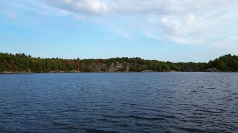 4K Drone Flying Low Over The Crystal Clear Water Of McCrae Lake, Canada Stock Footage 256704612