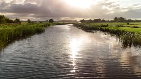 4K Drone Flying Low Over Canal Water Reflection Netherlands Summer 库存影片 317401796