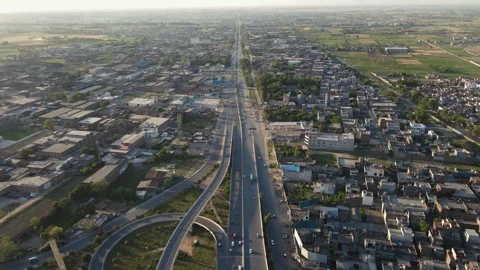 4k: Drone flying over a busy road in the city of Punjab, Pakistan Stock Footage 249044980