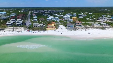4K Drone Flying Over Emerald Green Ocean Water To Small Town Stock Footage 109229844