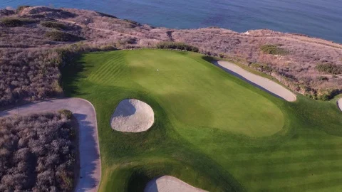 4K drone flying over green and cliff edge at Trump National LA golf course Stock Footage 89646928
