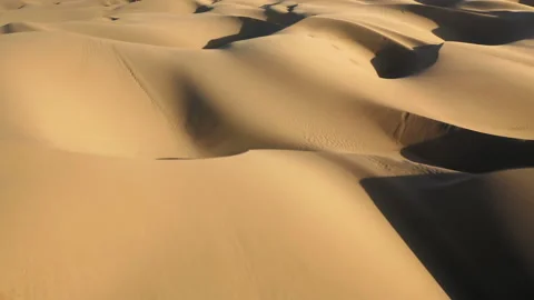 4K drone flying over sand dunes in golden sunset light. Abstract background 스톡 동영상 134569496