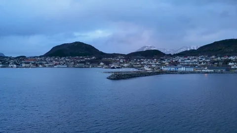4K Drone: Flying over a scenic winter harbour surrounded by snowy fjords, Norway Vidéo 337018725