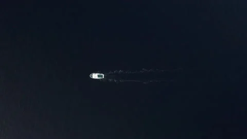 4K Drone flying over white boat sailing in deep blue ocean leaving slight trace Stock-Footage 158916368