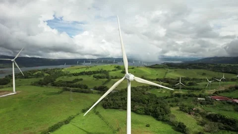 4K Drone Flying to Reveal Wind Farm of Renewable Energy Stock Footage 256828286