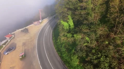 4K Drone Flying Toward Sea Fog Above a Coastal Cliff at Sunset Stock Footage 339277327