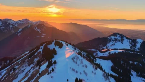 4K Drone Flying Toward Snowy Alpine Ridge at Sunset Above Lake Leman Stock Footage 330107893