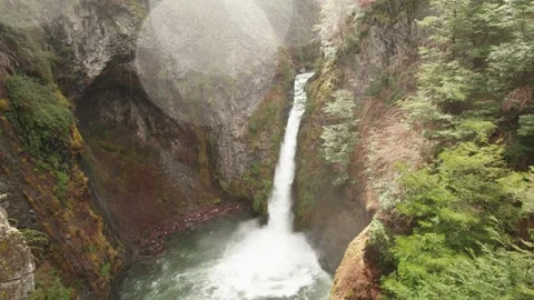 4K drone flying towards over a beautiful waterfall on a rainy day Stock Footage 248998168