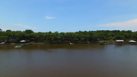 4K Drone Flying Towards Trees From Over Lake 库存影片 109356829