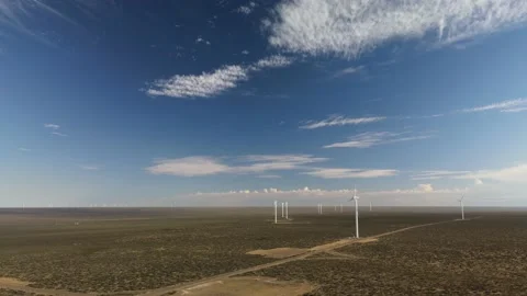 4K Drone flying towards an a wind turbine generator farm in the desert. Stock Footage 154614578