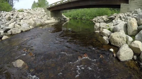 4k drone flying under bridge with stream (aerial) Stock Footage 51742437