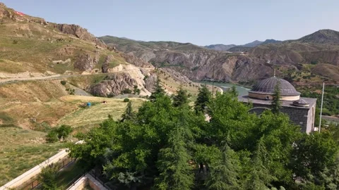 4K Drone Flyover Above Mosque Moving Forward Over Riverside Landscape Stock Footage 336244886