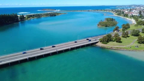 4K Drone Flyover Bridge Toward Ocean River Mouth Stock Footage 331628129