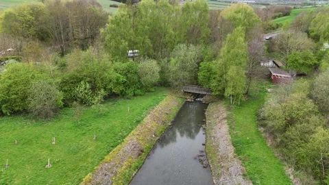 4K Drone Flyover of Nature, Fields, and Countryside Road Stock Footage 322788559