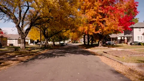 4K Drone flythrough video of charming neighborhood in Autumn colors in Wichita Stock Footage 168315099