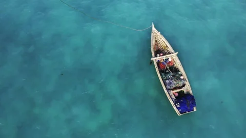 4K drone footage camera showing fishing boat on turquoise water. Stock-Footage 166238095
