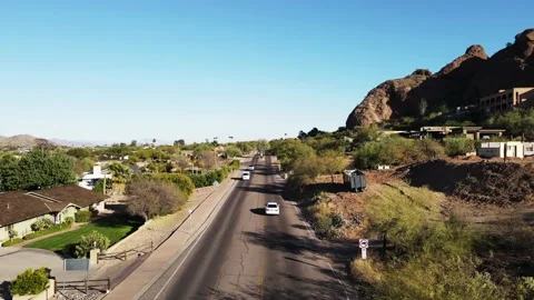 4k drone footage driving down the road in paradise valley, az Stock Footage 146300236
