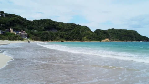 4K Drone Footage: Japan's Summer Beach, White Sands, Clear Waves &amp; Crystal-Clear Stock Footage 281615053
