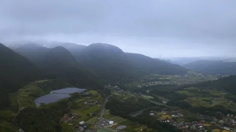 4k drone footage - Mountains, fields, and villages of Gunma Prefecture.  Japan Stock Footage 96044365