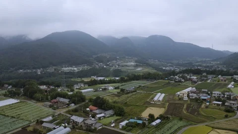 4k drone footage - Mountains, fields, and villages of Gunma Prefecture.  Japan Stock Footage 96045561