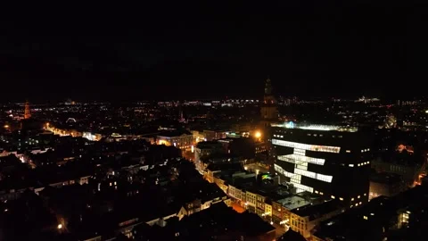 4K drone footage night time zoom out and pan Groningen skyline Netherlands Stock Footage 171129799