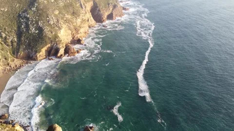 4K Drone Footage of Ocean Waves and Cliffs at Sunset in Portugal Stock Footage 311949820