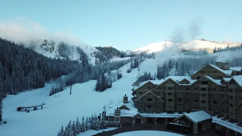 4K Drone Footage Snow in the Utah Mountains Deer Valley Chimney Smoke Stock Footage 143753117