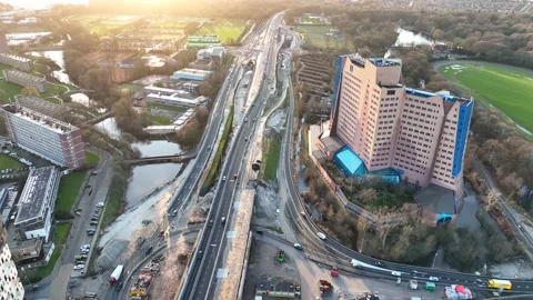 4K drone footage static highway construction at sunset Stock Footage 171210576