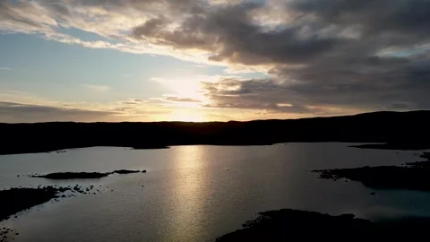 4K drone footage of sunset over Loch Ronard on Coll, Hebrides, Scotland Stock Footage 316424662