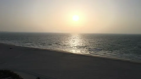 4K Drone footage, Sunset time drone passing over calm Arabic Ocean and coast Stock Footage 156515604